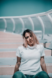 Young woman sitting outdoors