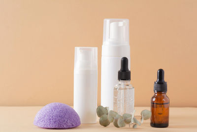 Beauty, spa and wellness concept. facial cosmetic products, konjac sponge on a beige background.