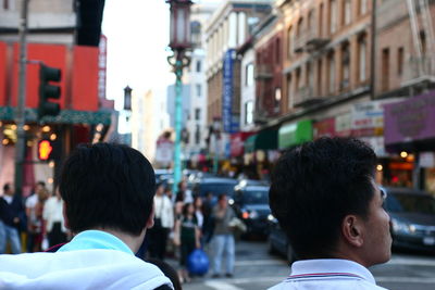 Rear view of woman standing in city