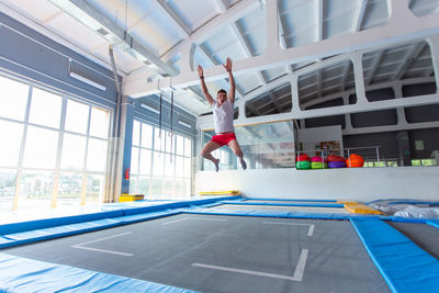 Man jumping in office