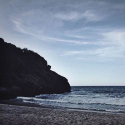 Scenic view of sea against cloudy sky