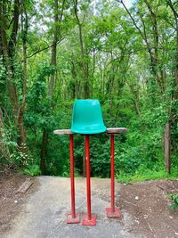 Empty chair in forest