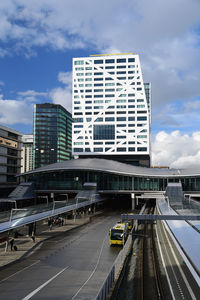 Central station with buildings against sky in city