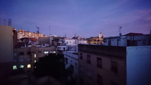 High angle view of buildings against sky at dusk