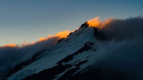 Scenic view of snow mountains against sky