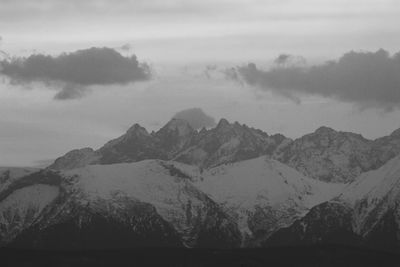 Scenic view of mountains against sky during winter