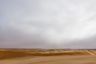 Scenic view of desert against sky