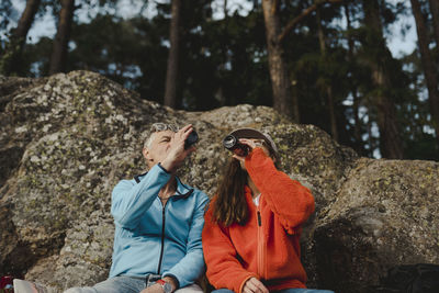 Couple of hikers having drinks