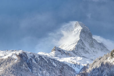Scenic view of snowcapped mountains against sky