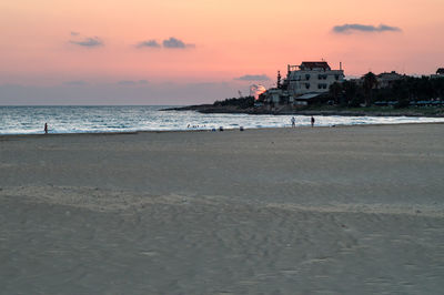 Scenic view of beach against sky during sunset