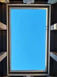 Low angle view of building against blue sky