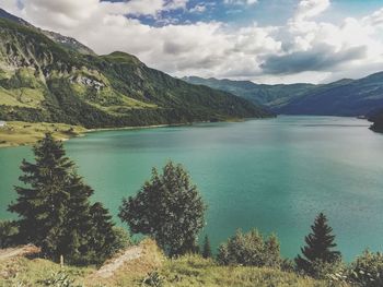 Scenic view of lake and mountains against sky