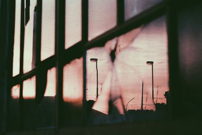 Close-up of person against window