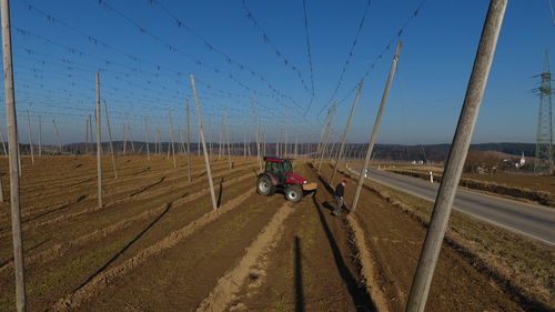 Panoramic view of agricultural field against clear sky