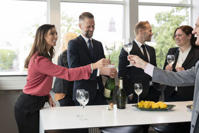 Business people celebrate with champagne