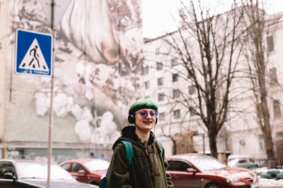 Portrait of smiling man in snow