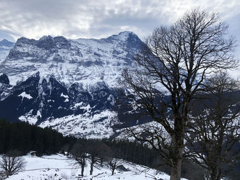 Scenic view of snow covered mountains against sky