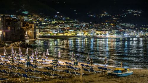 High angle view of illuminated buildings in city at night