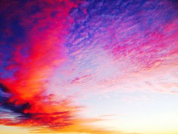 Low angle view of cloudy sky at sunset