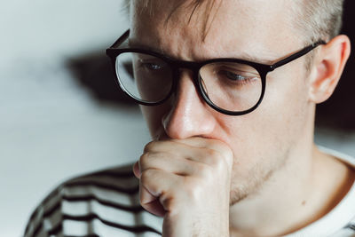 Close-up of young man in deep thoughts