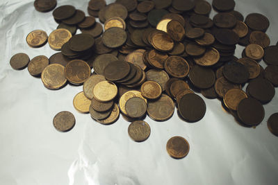 High angle view of coins on table