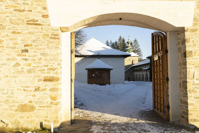 Built structure by wall of old building