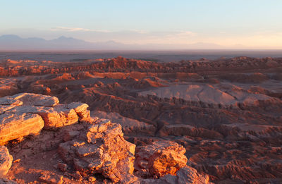 Scenic view of rock formation against sky during sunset