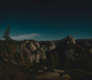 Scenic view of mountains against clear sky at night