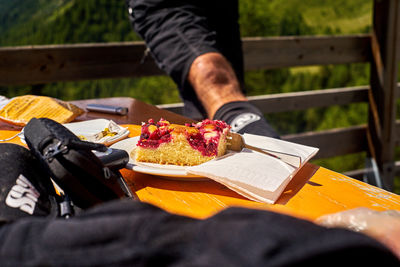 Midsection of man holding food