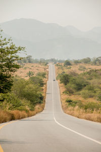 Empty road against sky