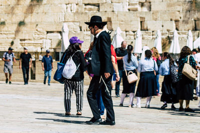 Group of people in front of historical building