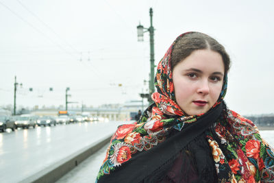 Portrait of beautiful woman on a bridge