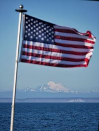 Close-up of flag against blue sky