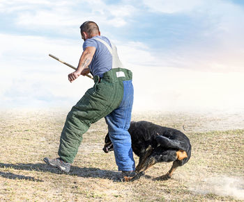 Side view of man standing on field