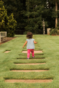 Rear view of boy on grass