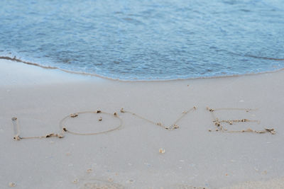 Heart shape on sand at beach