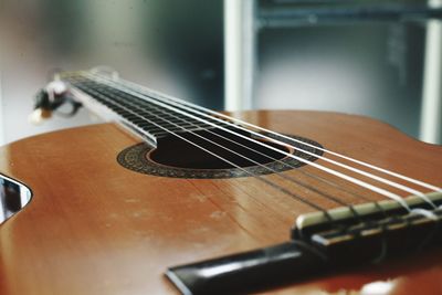 Close-up of guitar on table at home