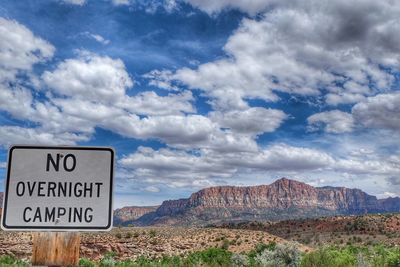 Scenic view of landscape against cloudy sky