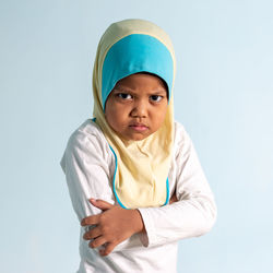 Portrait of boy against white background