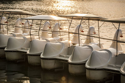 Chairs in row by sea