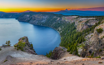 Scenic view of lake at sunset