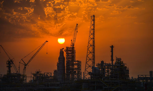 Sunrise over an oil refinery port south of kuwait city