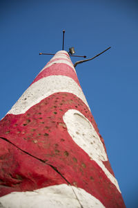 Low angle view of bell tower against blue sky