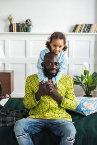 Portrait of friends sitting at home