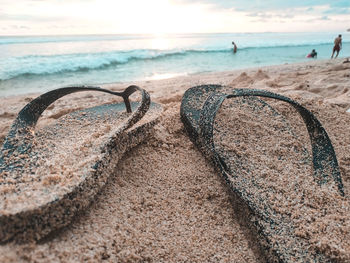 Close-up of sea shore against sky