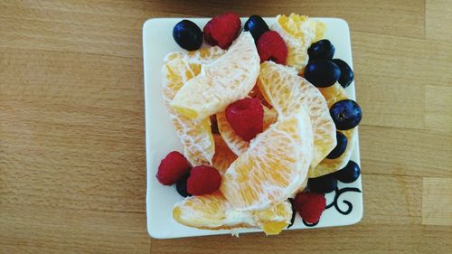 Directly above shot of fruits served on table