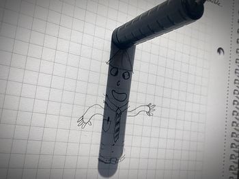 High angle view of pen on paper