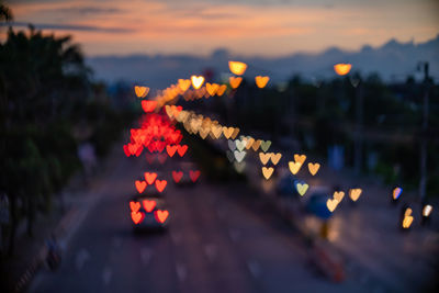 Heart shape bokeh from car light on the traffic road