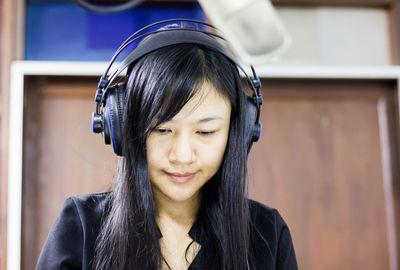 Close-up of radio presenter wearing headphones