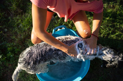 Low section of woman washing hands